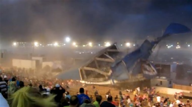 FILE - In this Aug. 13, 2011 file frame grab from video provided by Jessica Silas, a stage collapses at the Indiana State Fair in Indianapolis killing five and injuring dozens of fans waiting for the country band Sugarland to perform. In a Feb. 16, 2012, response to a civil suit filed in November, attorneys for Sugarland say the injuries fans suffered in the deadly collapse were their own fault because they failed to take steps to ensure their own safety before high winds toppled stage rigging. (AP Photo/Jessica Silas, File)